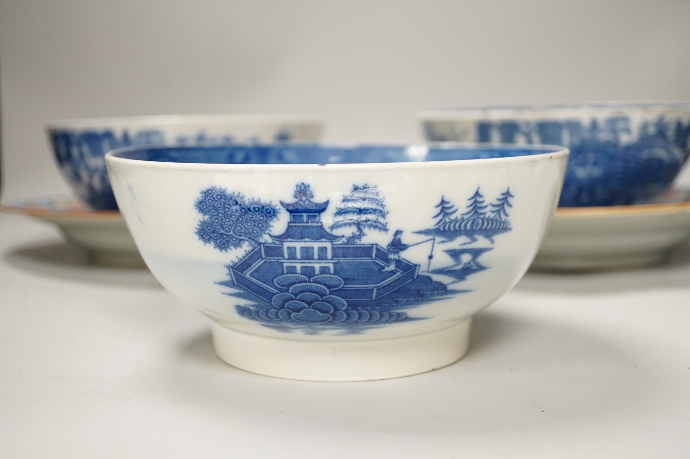 Three English pearlware blue and white bowls and two Samson plates